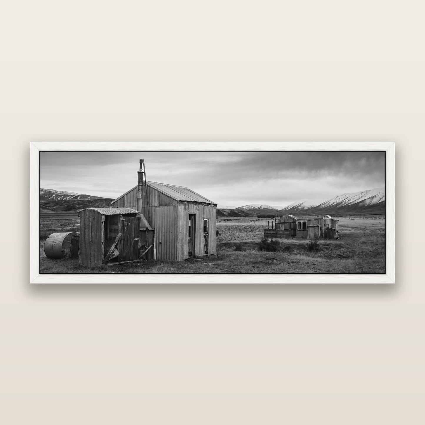 Whispers of Solitude, The Station Huts — black and white framed metallic canvas print, White frame. New Zealand fine art wall art by Stephen Milner.