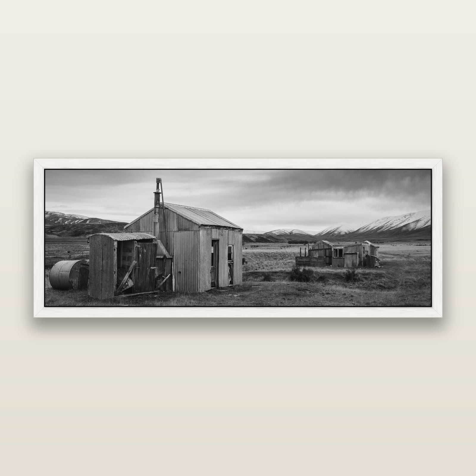 Whispers of Solitude, The Station Huts, black and white framed metallic canvas print, White frame. New Zealand fine art wall art by Stephen Milner.
