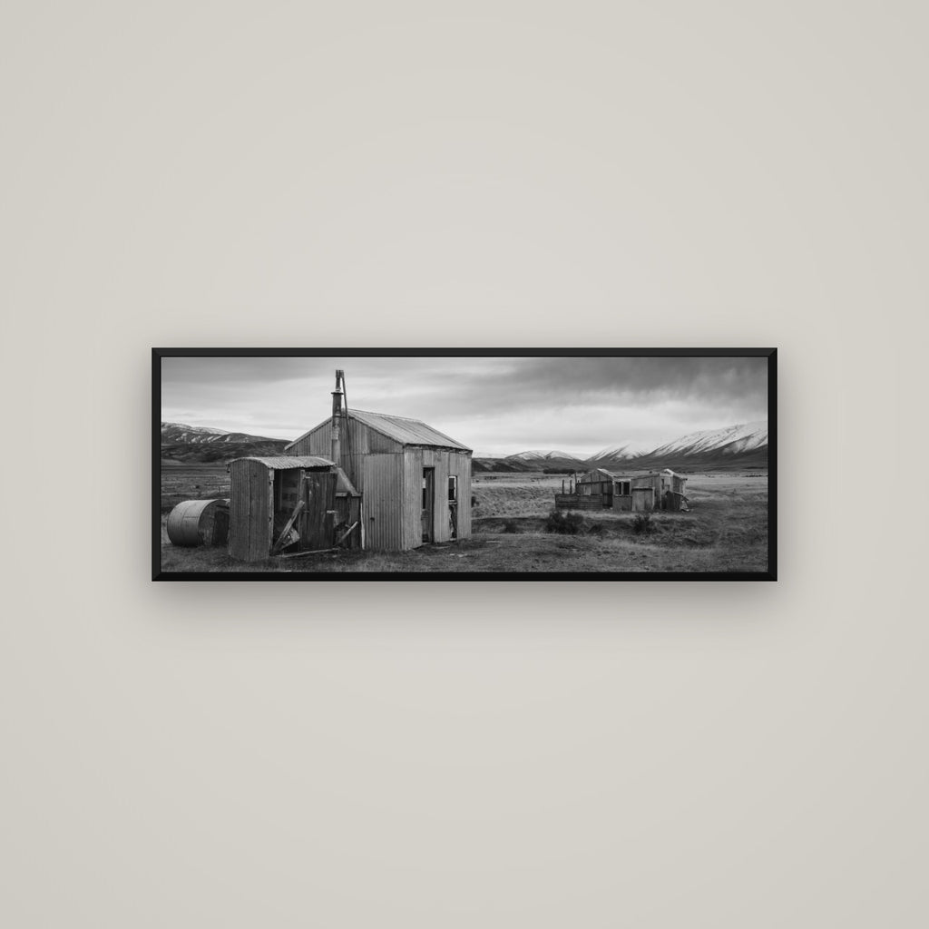 Whispers of Solitude, The Station Huts — Basel Black Matte, 113×40 cm. New Zealand fine art wall art by Stephen Milner.