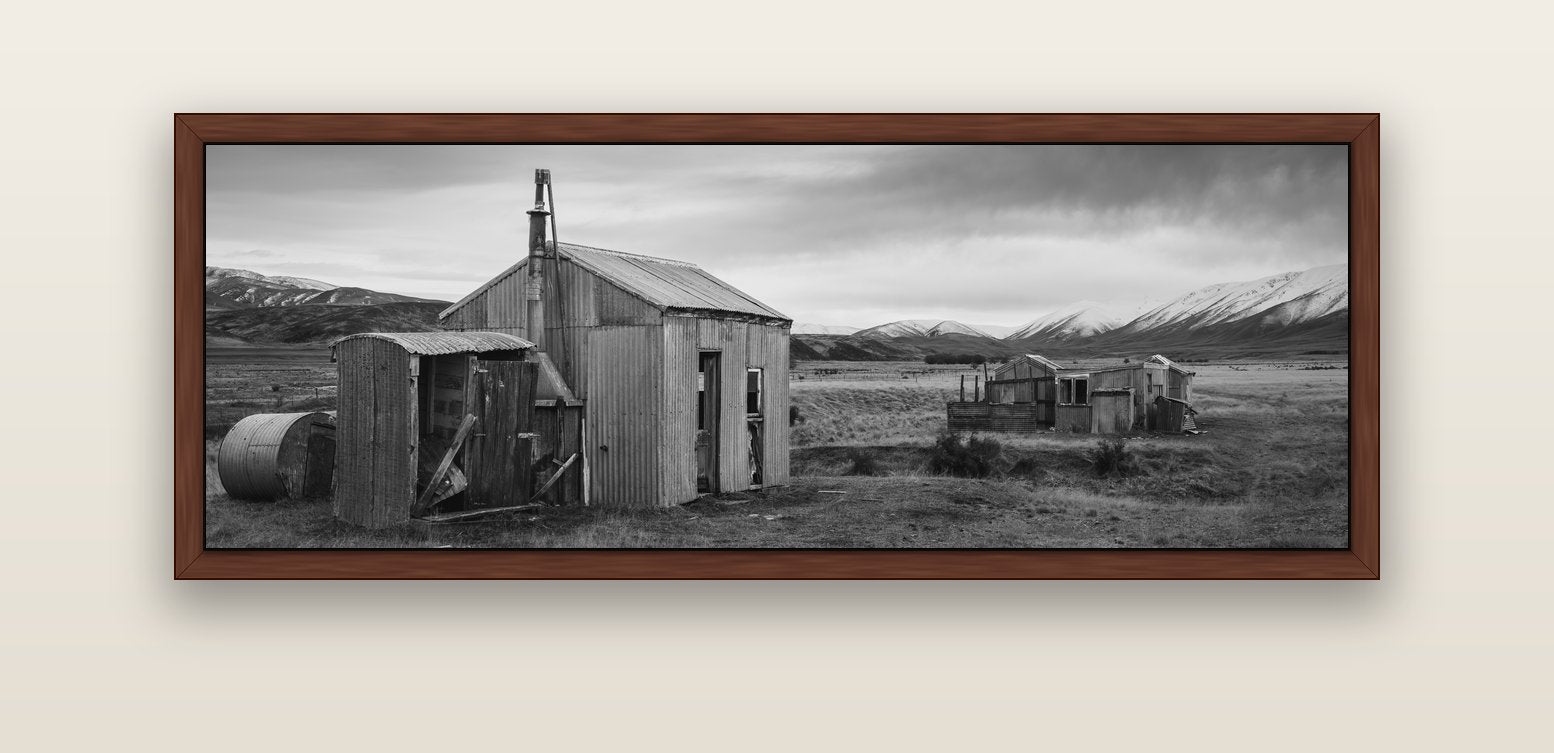 Whispers of Solitude, The Station Huts — brown float frame canvas, 152 × 56 cm. New Zealand fine art landscape wall art by Stephen Milner.
