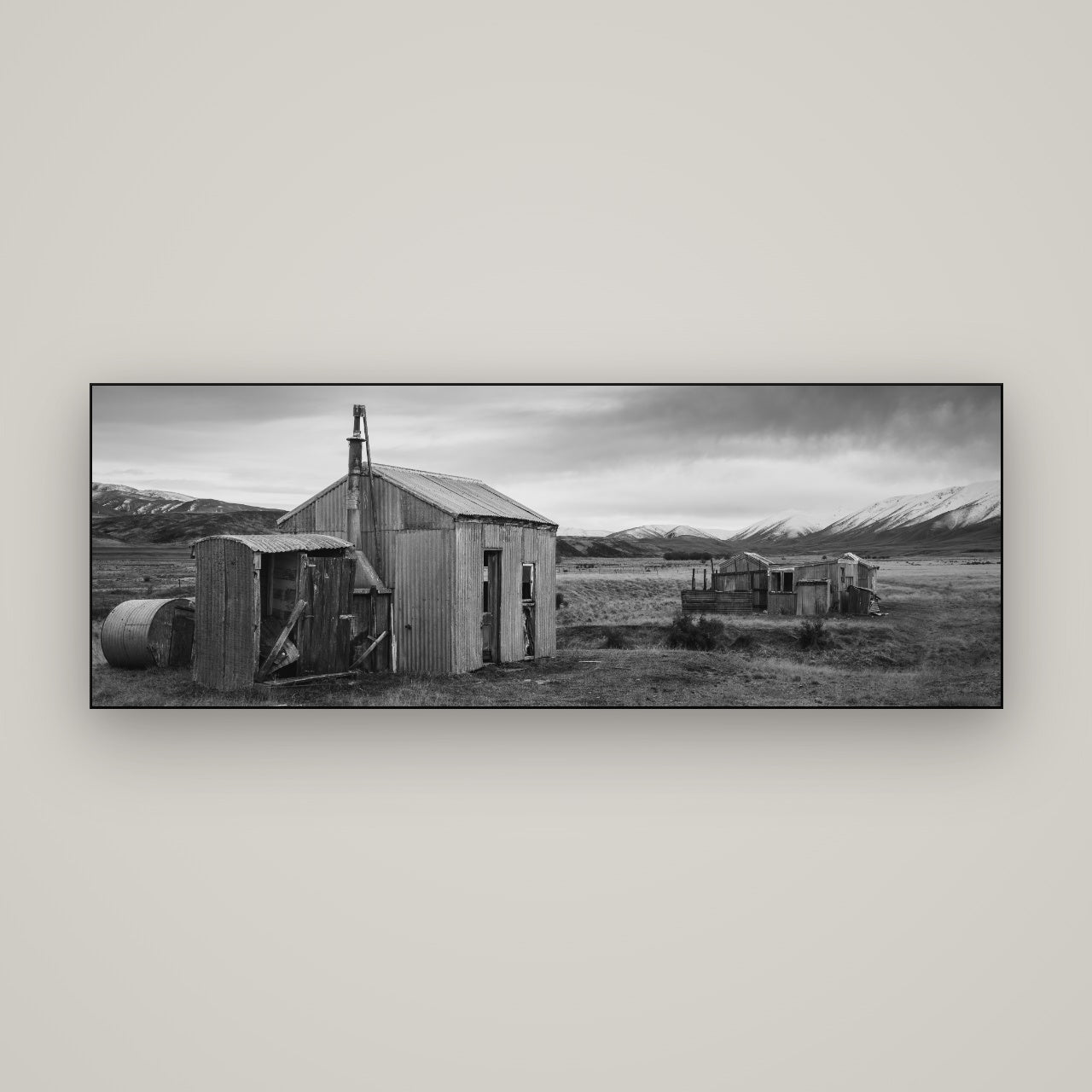 Whispers of Solitude, The Station Huts — Slimline Black, 170×60 cm. New Zealand fine art wall art by Stephen Milner.