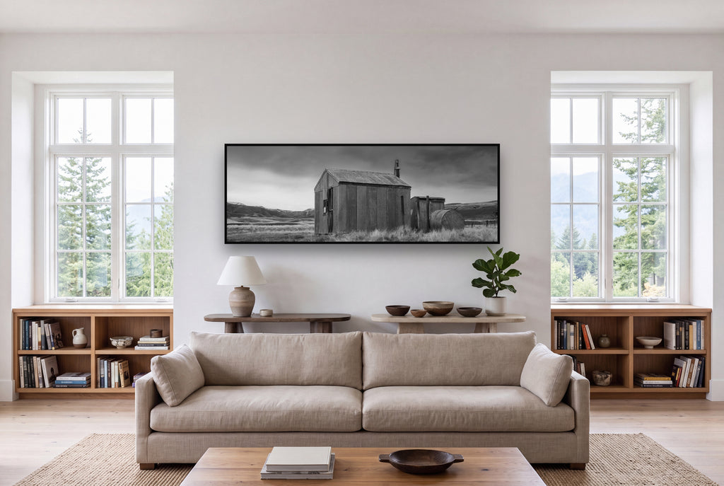 Whispers of Solitude, The Iron Hut shown as large black and white wall art in a styled room, fine art by Stephen Milner.